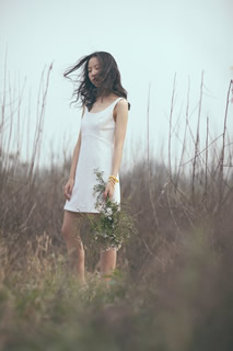 Woman standing on the grass.