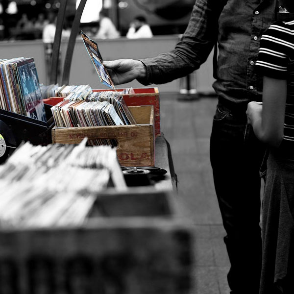 Guys buying a CD.