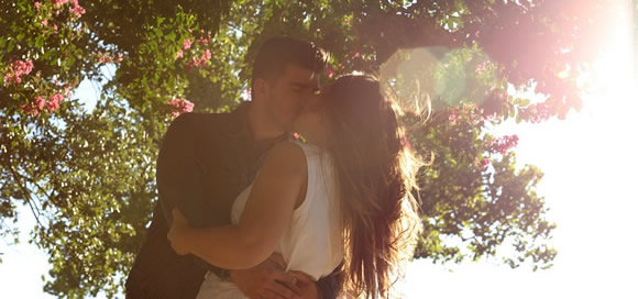 Couple kissing in a park