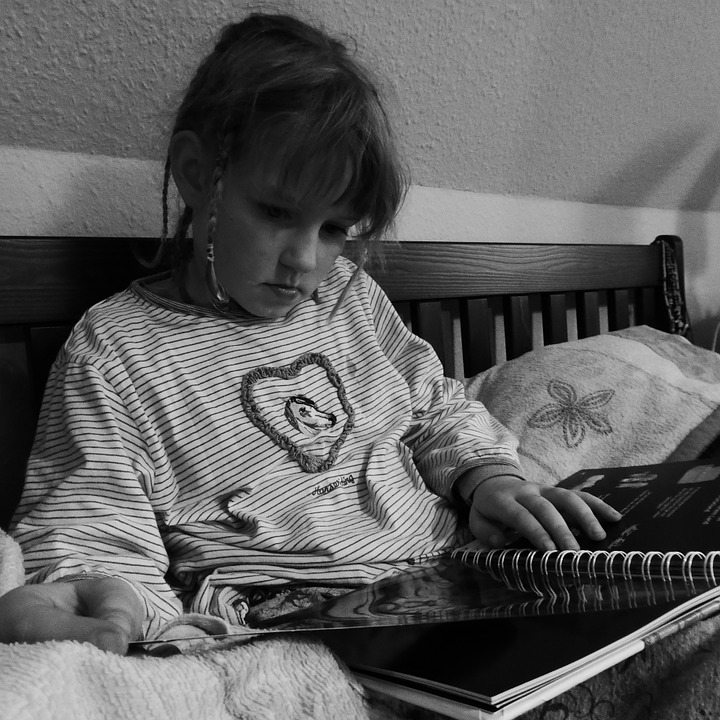 Young woman reading a handbook